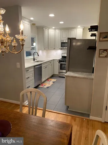 a kitchen with a stove and a cabinet