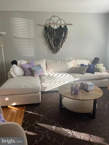 a living room with furniture and a rug