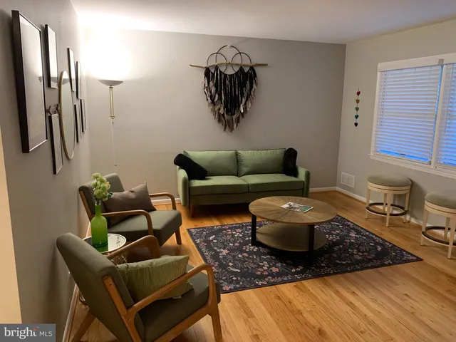 a living room with furniture and a rug