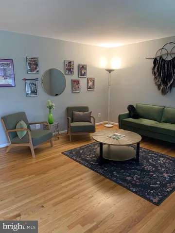 a living room with furniture and a rug