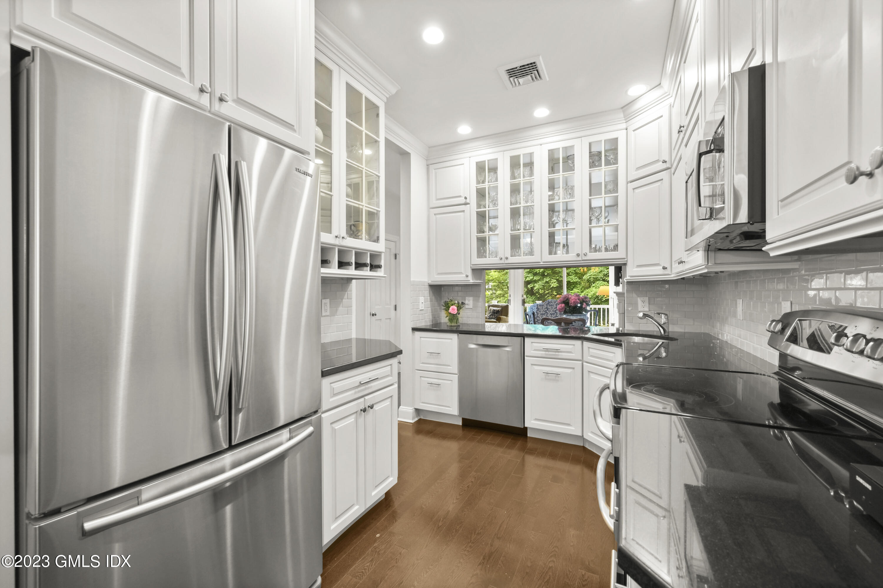 333 Palmer Hill Road, Unit 3B Riverside, CT 06878 - Photo 11 of 31 a kitchen with stainless steel appliances a refrigerator sink and stove