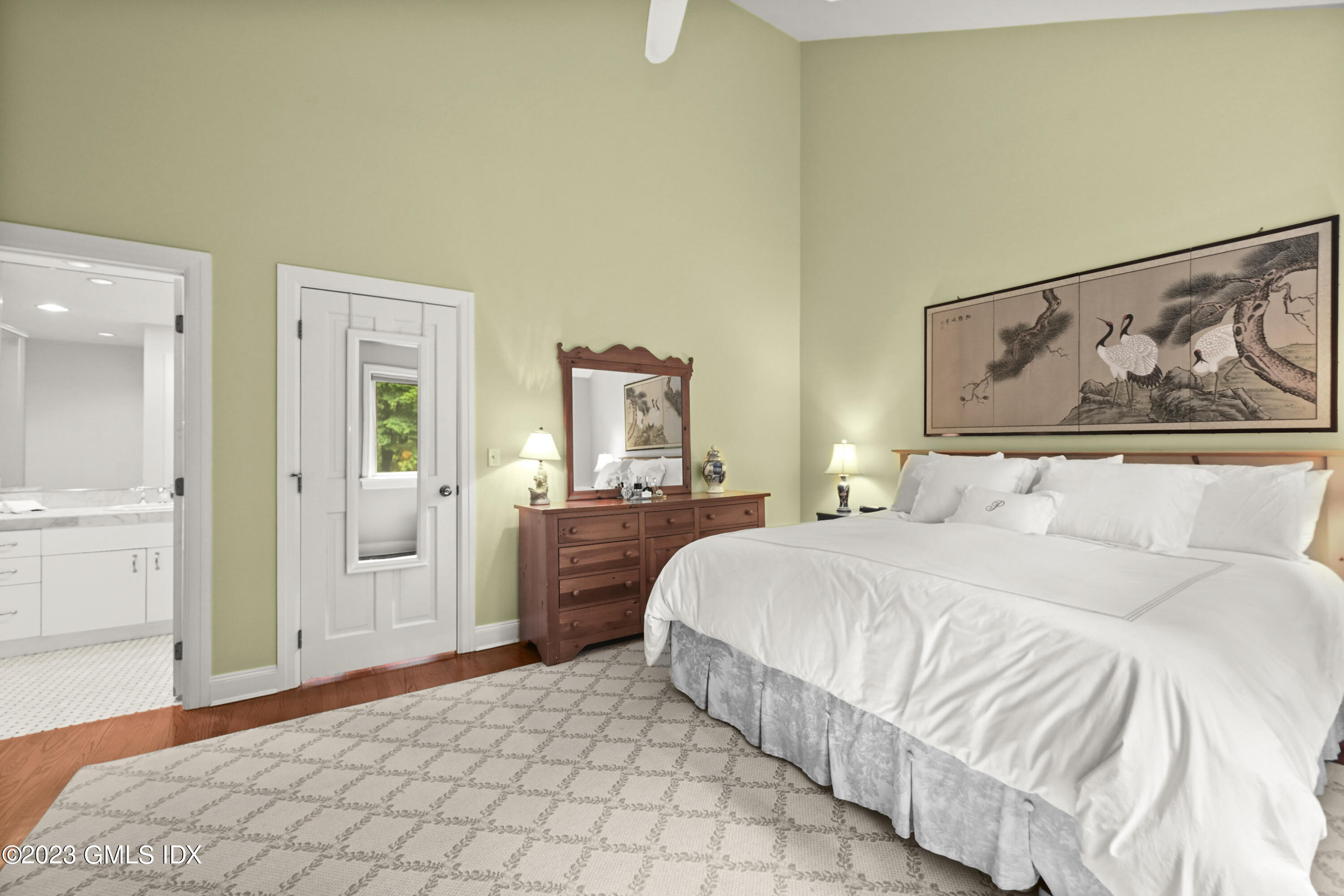 333 Palmer Hill Road, Unit 3B Riverside, CT 06878 - Photo 19 of 31 a bedroom with a large bed and painting on the wall