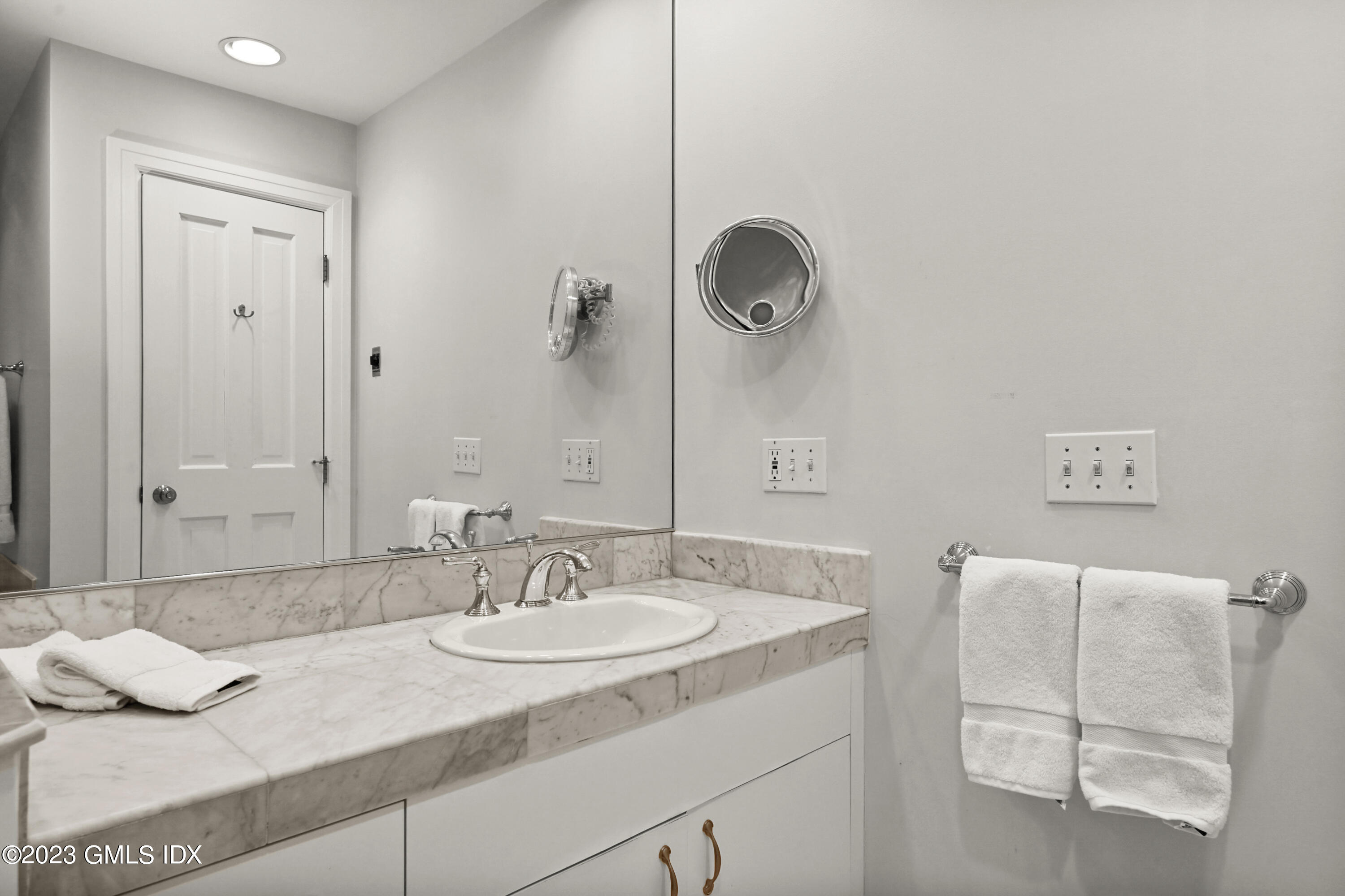 333 Palmer Hill Road, Unit 3B Riverside, CT 06878 - Photo 20 of 31 a bathroom with a granite countertop sink and a mirror