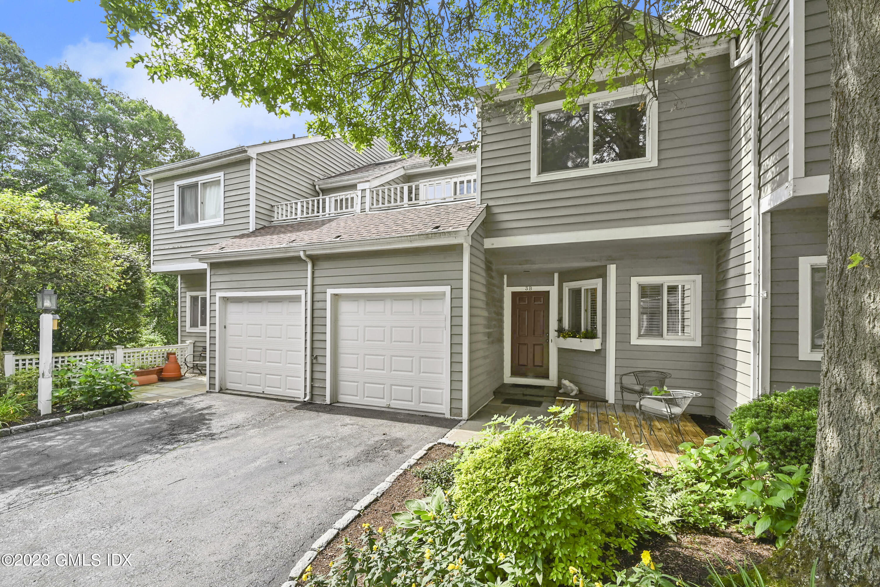 333 Palmer Hill Road, Unit 3B Riverside, CT 06878 - Photo 2 of 31 front view of a house with a yard