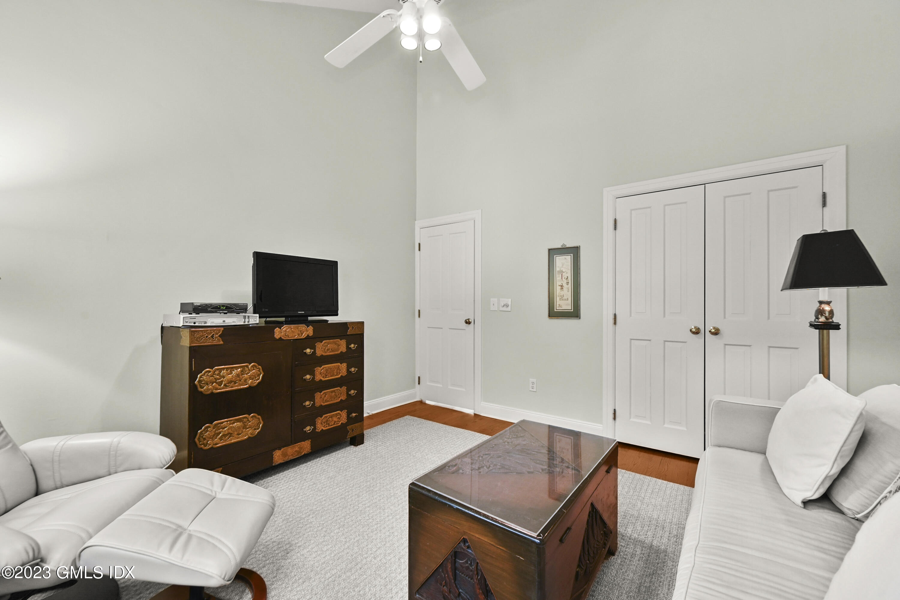 333 Palmer Hill Road, Unit 3B Riverside, CT 06878 - Photo 23 of 31 a bedroom with furniture and a flat screen tv
