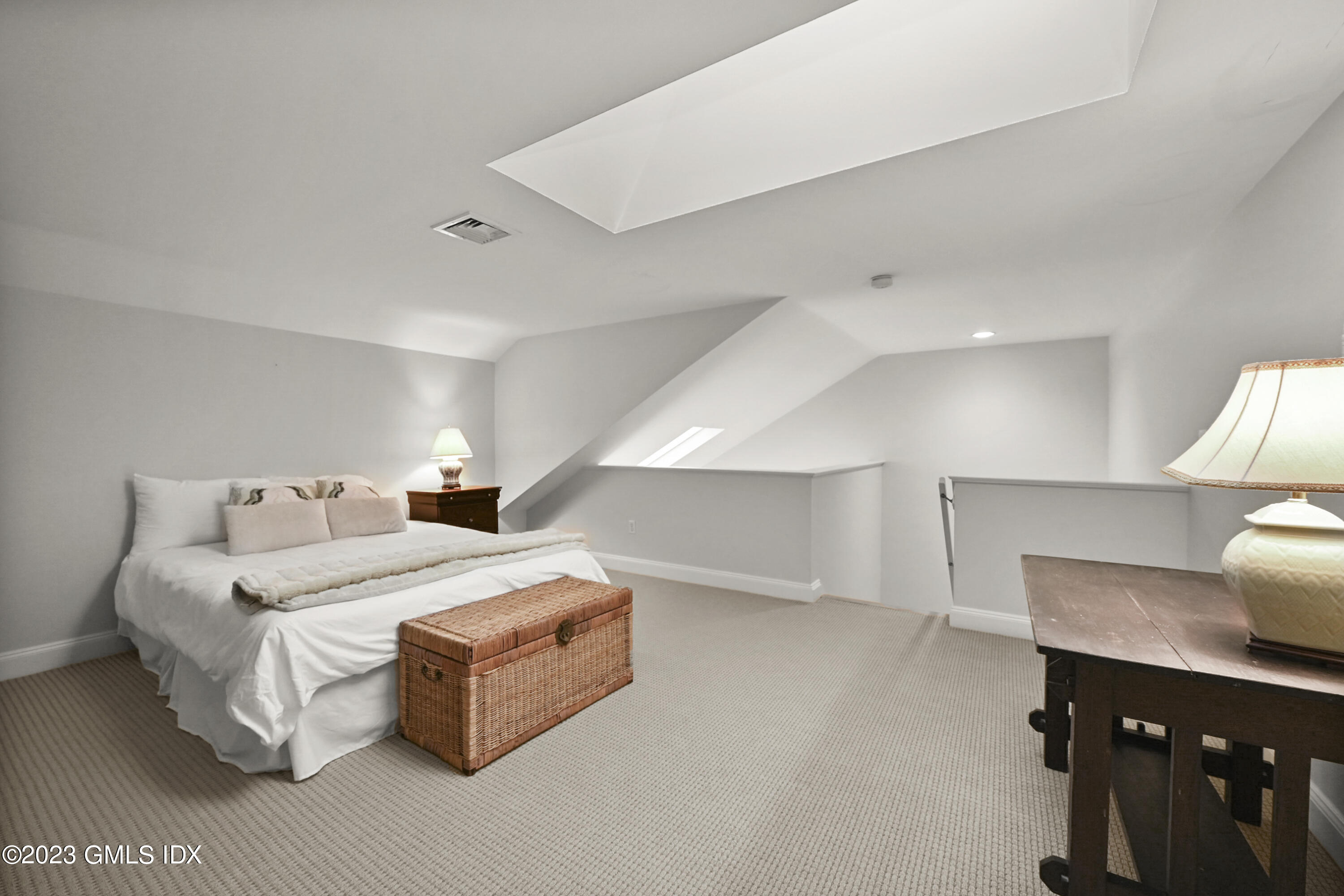 333 Palmer Hill Road, Unit 3B Riverside, CT 06878 - Photo 25 of 31 a bed room with a bed and a night stand