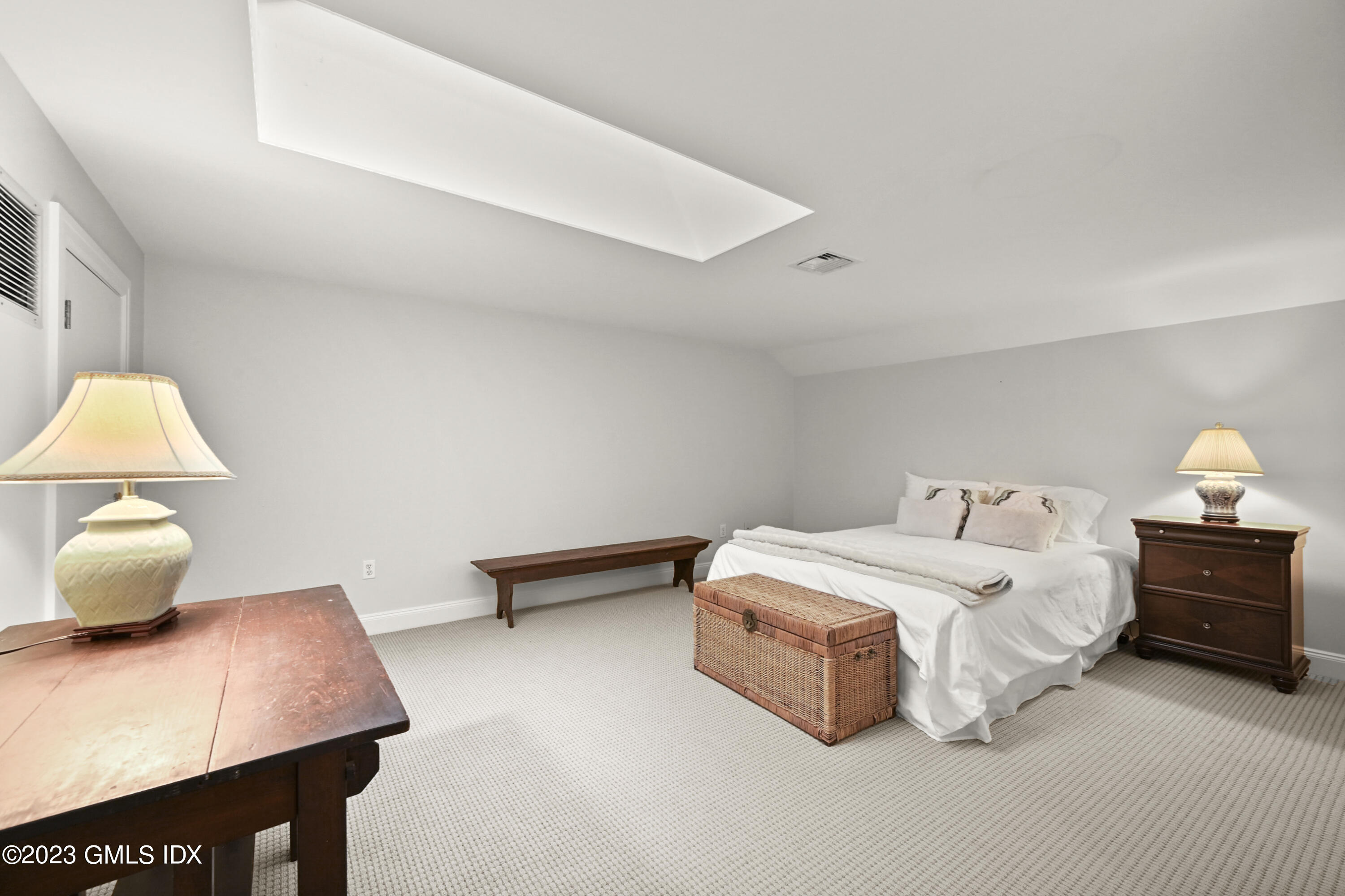 333 Palmer Hill Road, Unit 3B Riverside, CT 06878 - Photo 26 of 31 a bedroom with a bed and a lamp