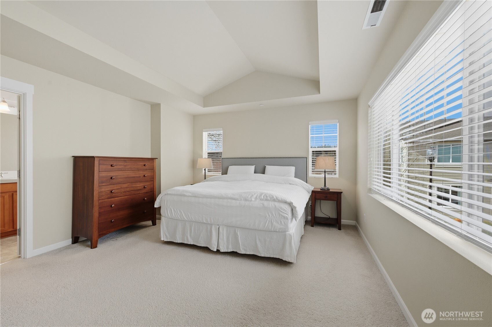 18635 101st Avenue Northeast, Unit 6 Bothell, WA 98011 - Photo 11 of 23 a spacious bedroom with a bed and a window