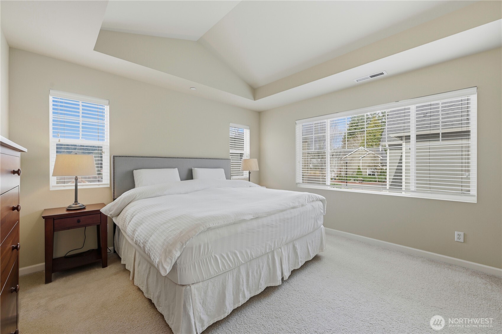 18635 101st Avenue Northeast, Unit 6 Bothell, WA 98011 - Photo 12 of 23 a bedroom with a bed and a window
