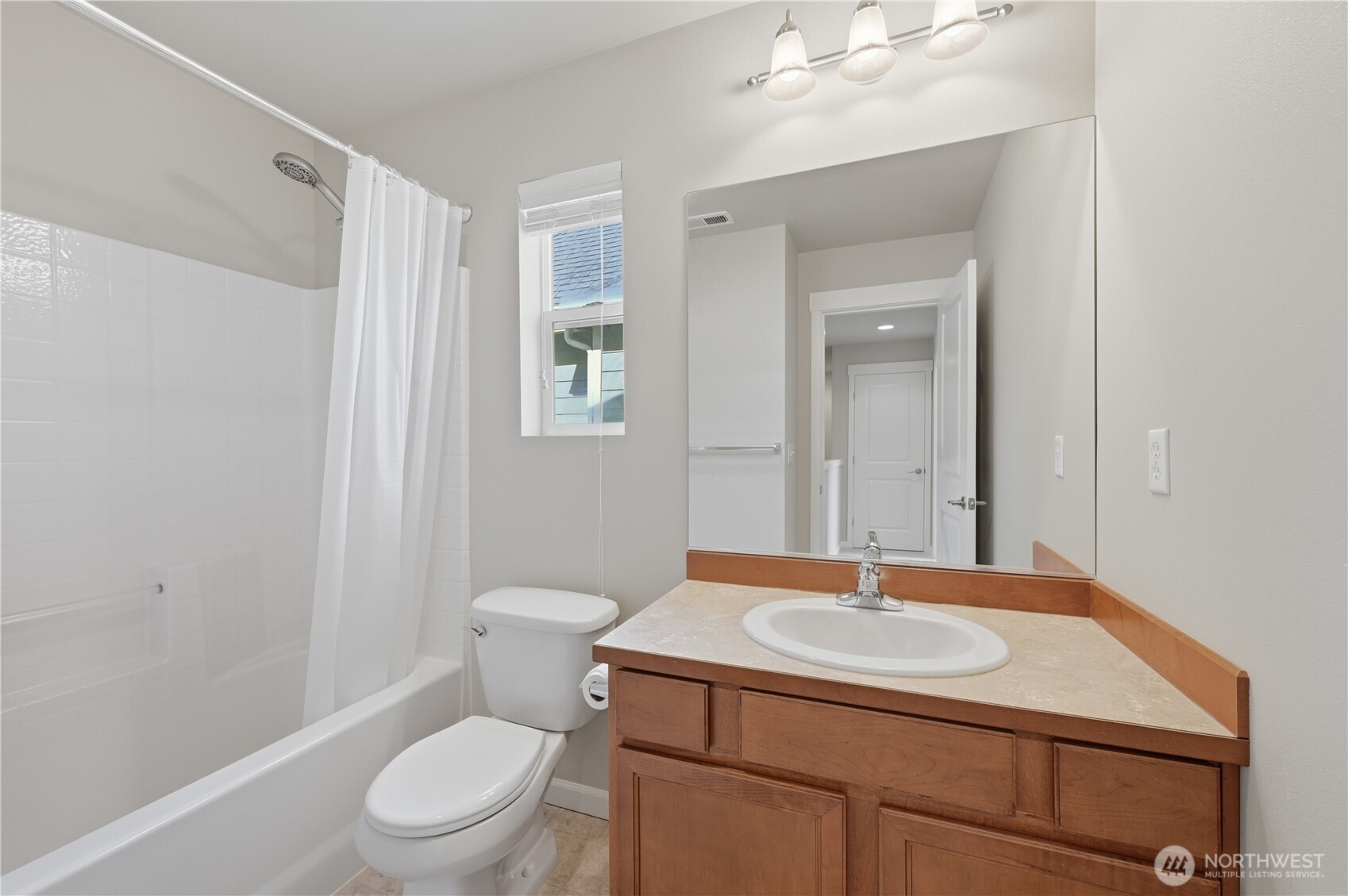 18635 101st Avenue Northeast, Unit 6 Bothell, WA 98011 - Photo 17 of 23 a bathroom with a sink a toilet and shower