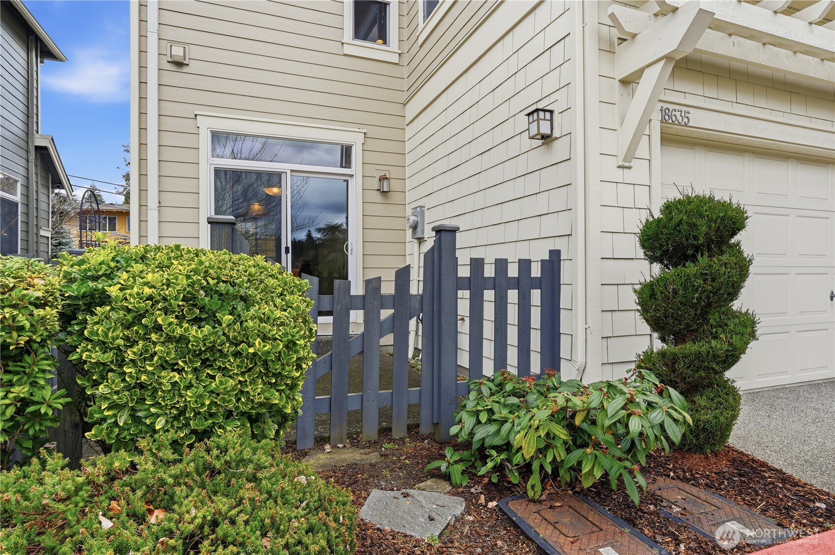 18635 101st Avenue Northeast, Unit 6 Bothell, WA 98011 - Photo 20 of 23 a view of a house with potted plants
