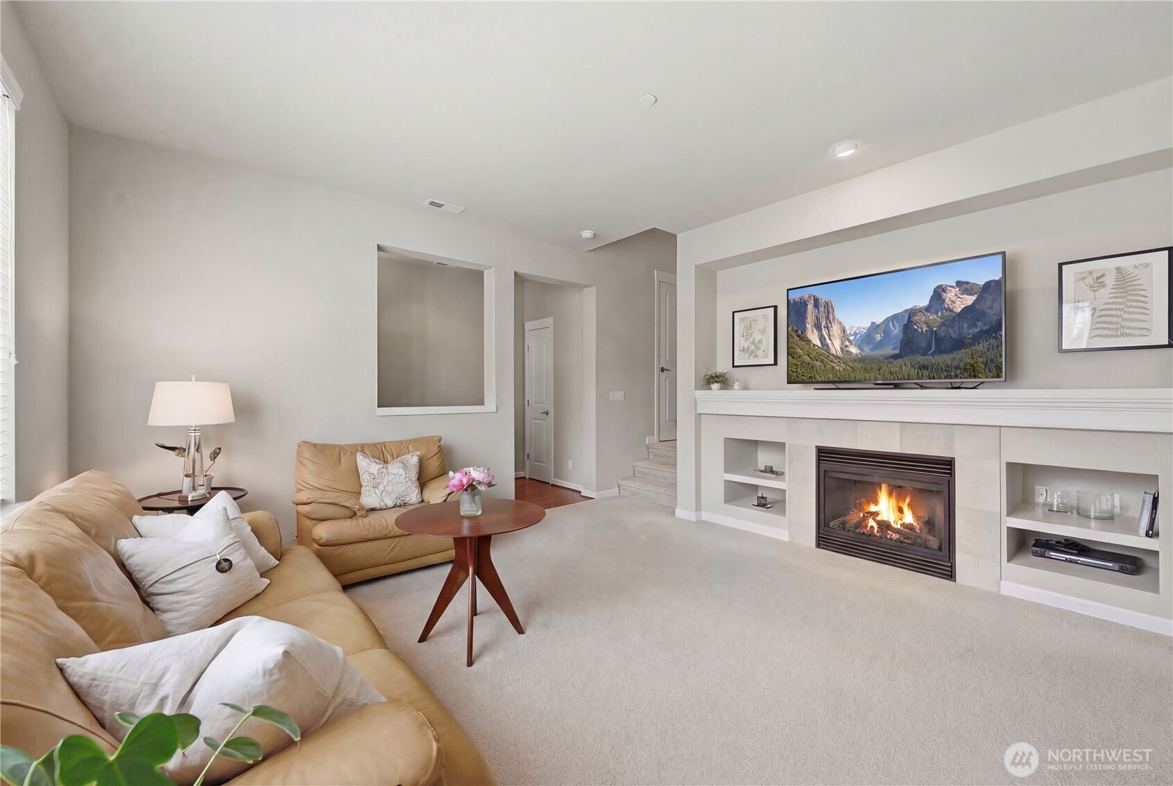18635 101st Avenue Northeast, Unit 6 Bothell, WA 98011 - Photo 2 of 23 a living room with furniture and a fireplace