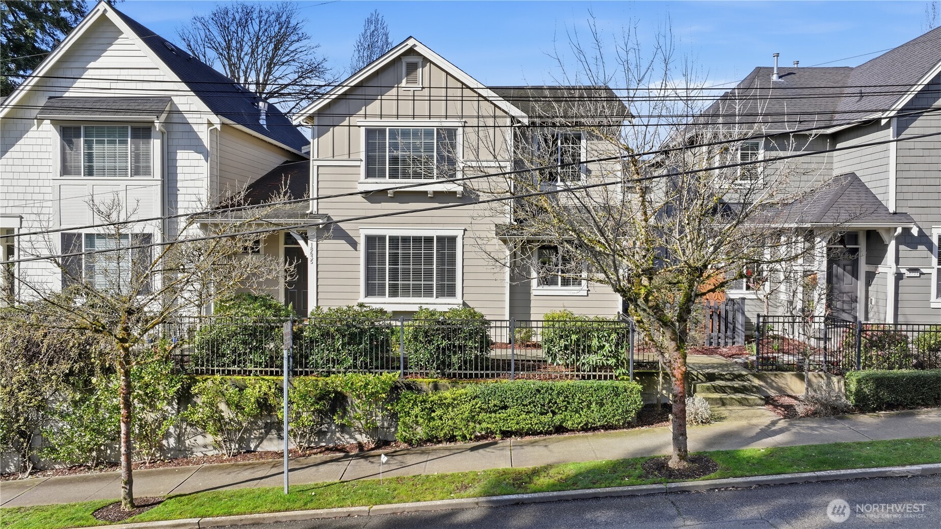 18635 101st Avenue Northeast, Unit 6 Bothell, WA 98011 - Photo 23 of 23 a front view of a house with a yard