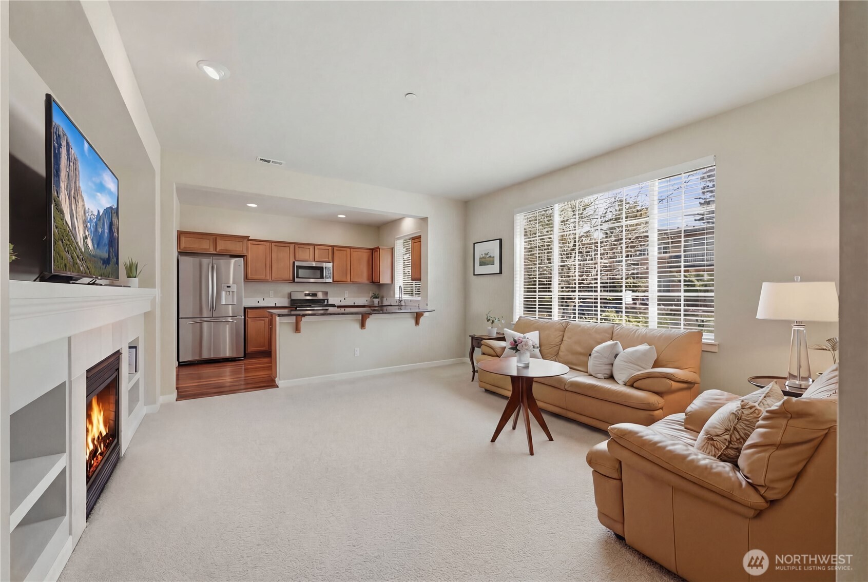 18635 101st Avenue Northeast, Unit 6 Bothell, WA 98011 - Photo 4 of 23 a living room with furniture and a fireplace