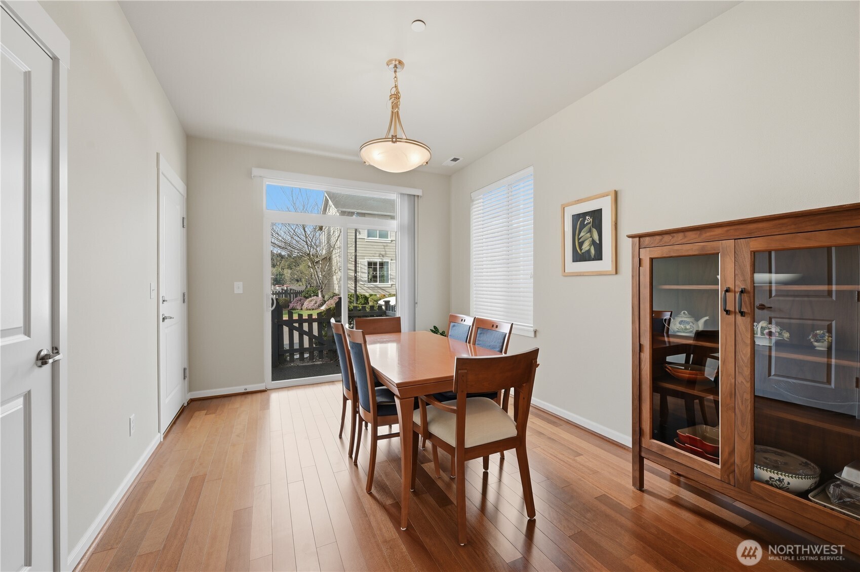 18635 101st Avenue Northeast, Unit 6 Bothell, WA 98011 - Photo 9 of 23 a view of a dining room with furniture and wooden floor