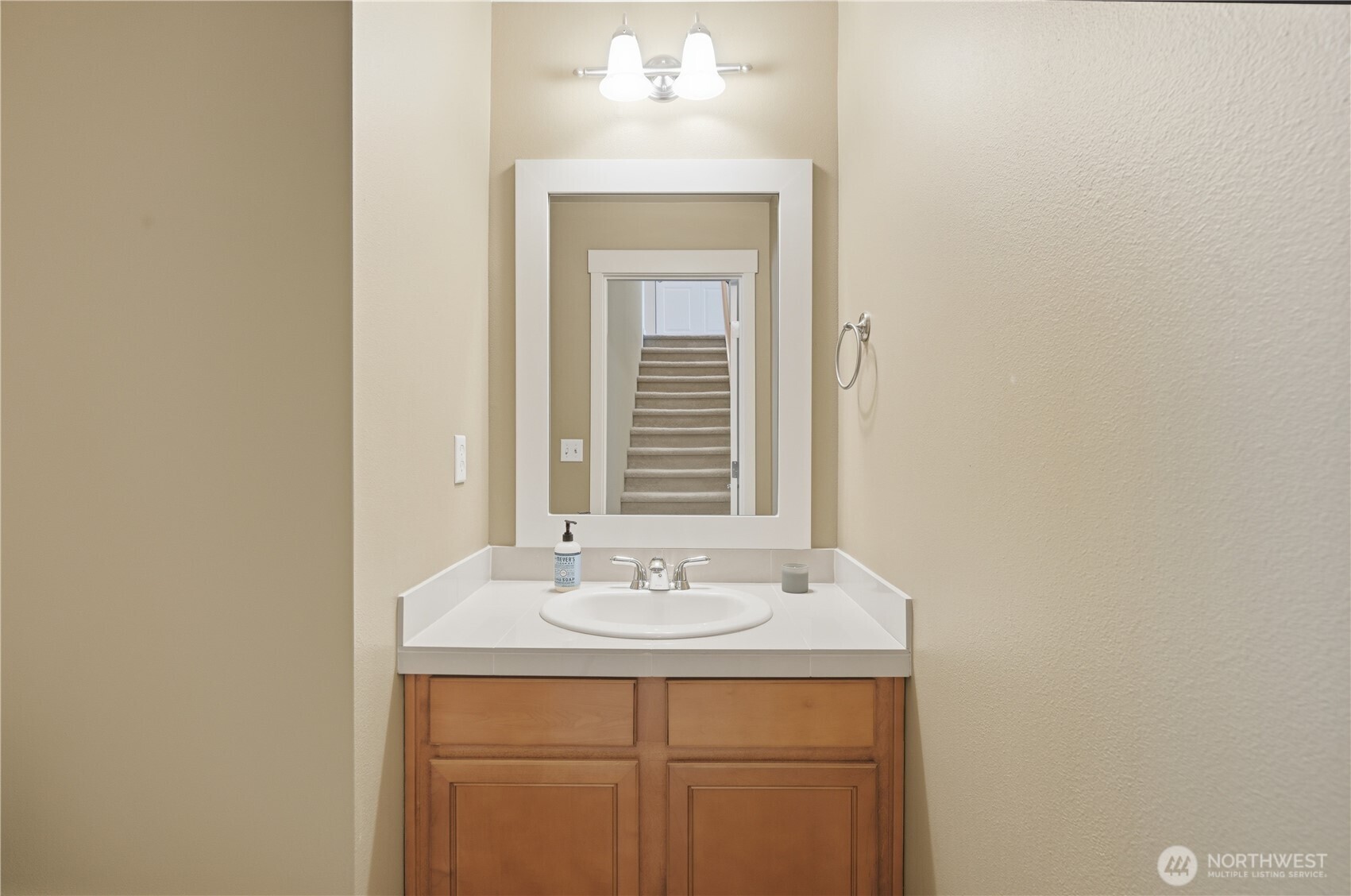 18635 101st Avenue Northeast, Unit 6 Bothell, WA 98011 - Photo 10 of 23 a bathroom with a sink and a mirror