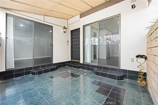 a bathroom with a glass door shower