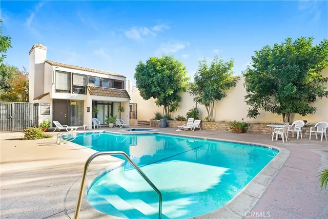 a view of a swimming pool with chairs