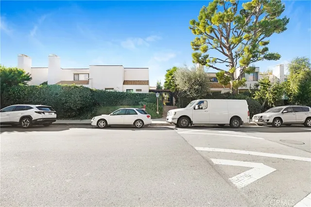 a view of a cars parked in front of a house