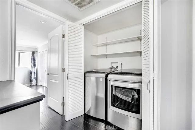 a kitchen with a stove and a refrigerator