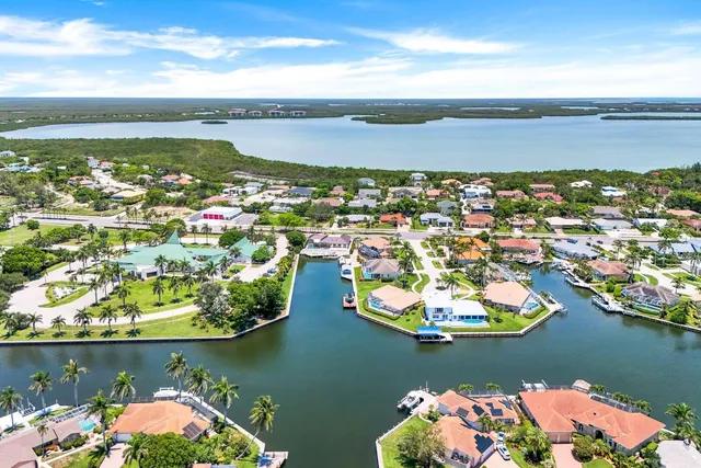 an aerial view of a house with a lake view