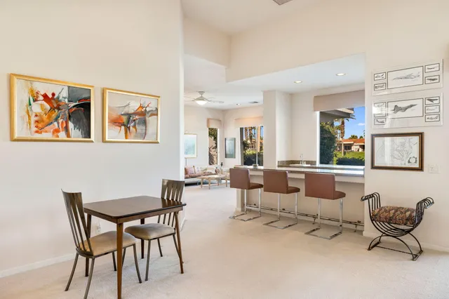 a living room with furniture and a lamp