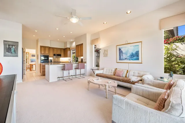 a bathroom with a toilet a sink and a mirror