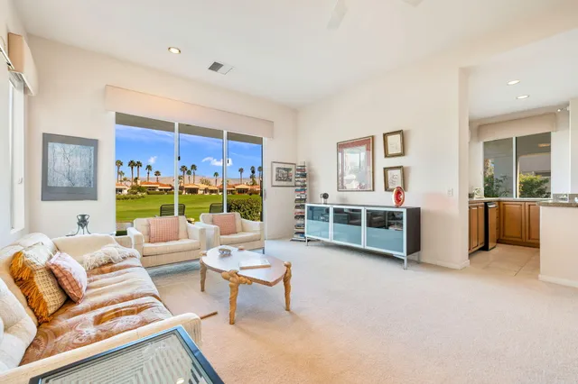 a front view of a house with swimming pool yard and patio