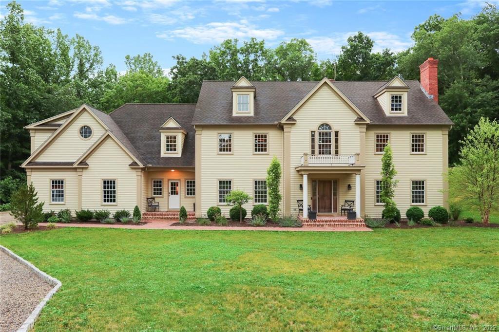 115 Judd Road Easton, CT 06612 - Photo 1 of 1 a front view of house with yard and green space