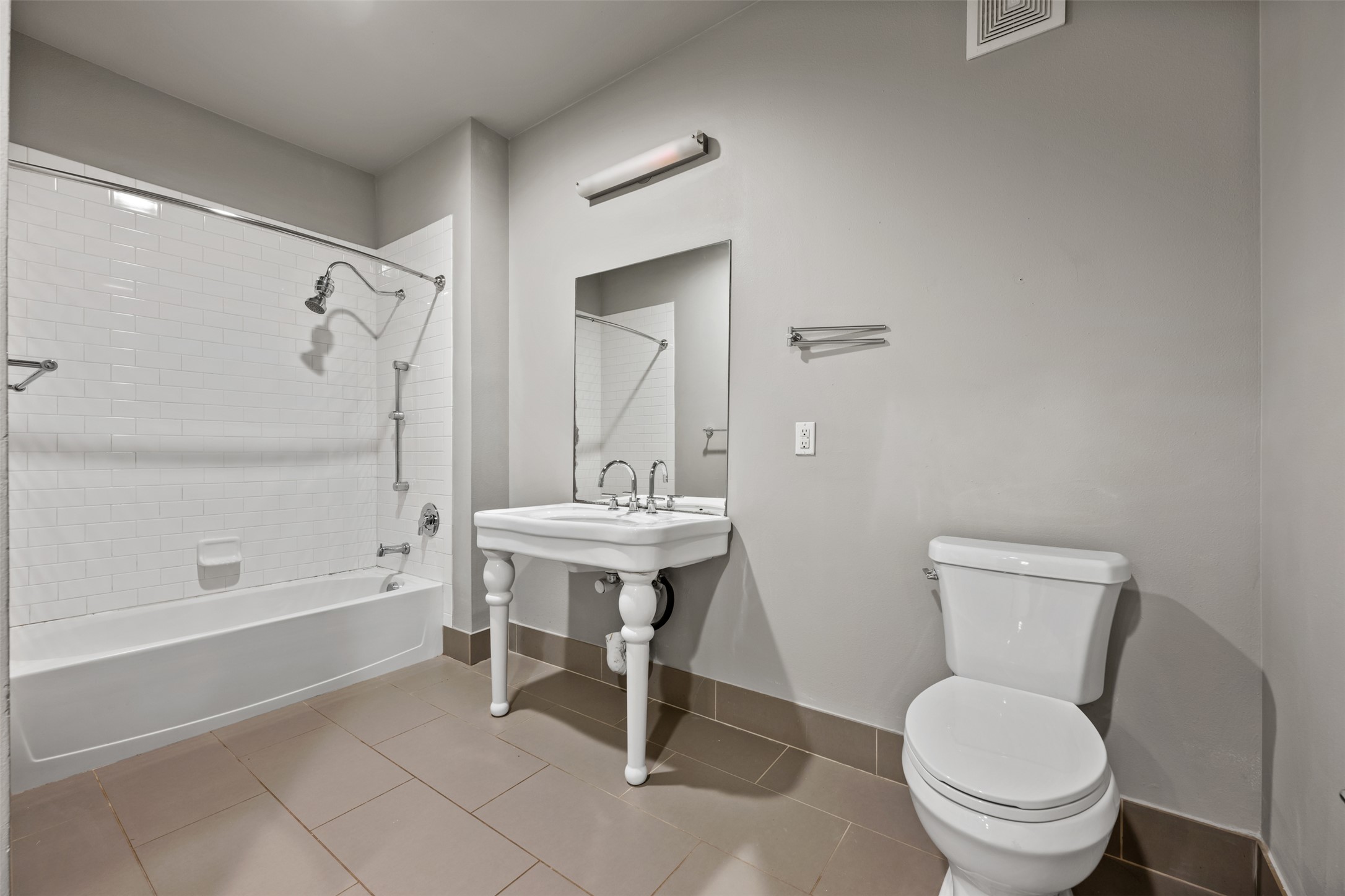 2804 Treble Lane, Unit 902 Austin, TX 78704 - Photo 21 of 31 a bathroom with a sink a toilet and a mirror