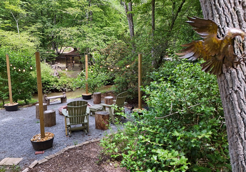 789 Old Mill Pond Road Mineral Bluff, GA 30559 - Photo 16 of 59 a view of a patio with chairs and plants