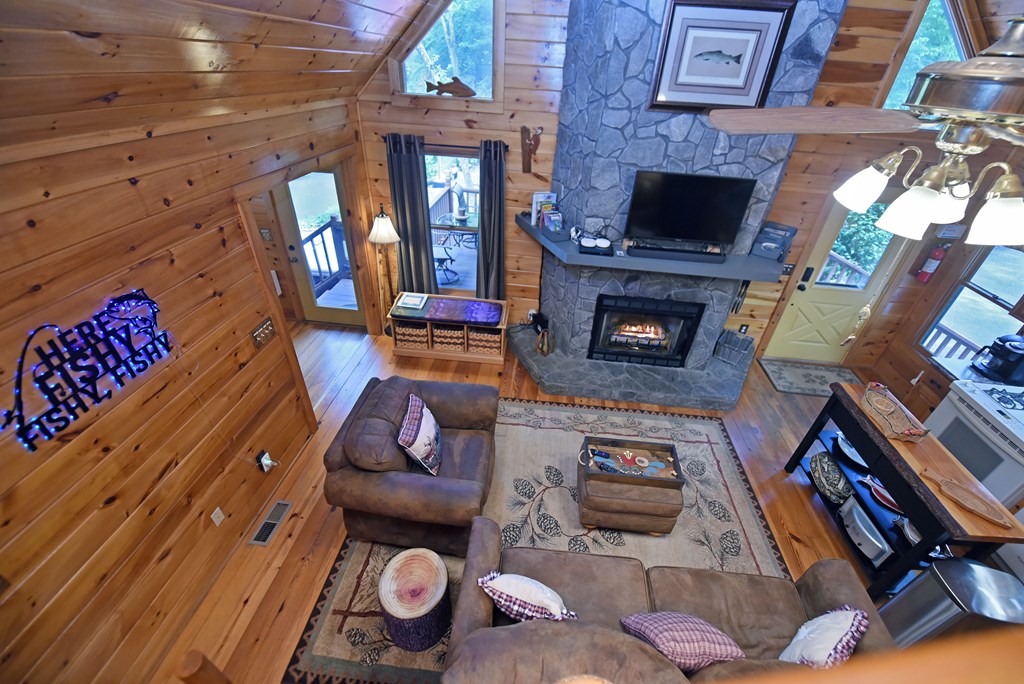 789 Old Mill Pond Road Mineral Bluff, GA 30559 - Photo 27 of 59 a living room with furniture and a fireplace