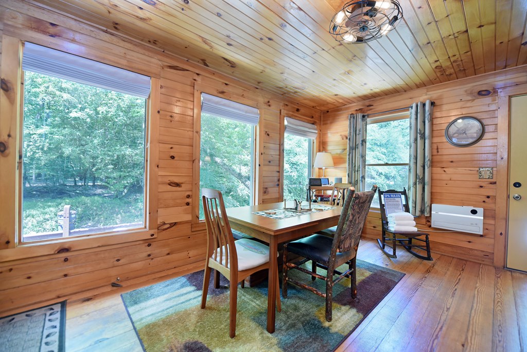 789 Old Mill Pond Road Mineral Bluff, GA 30559 - Photo 34 of 59 a view of a dining room with furniture window and wooden floor