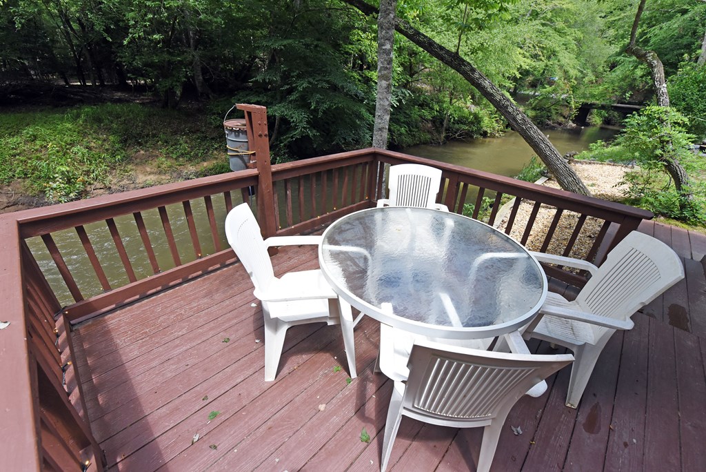 789 Old Mill Pond Road Mineral Bluff, GA 30559 - Photo 41 of 59 a view of balcony with furniture and garden