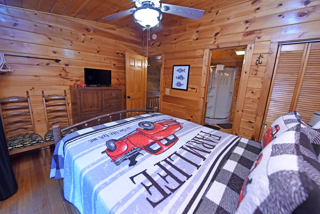 789 Old Mill Pond Road Mineral Bluff, GA 30559 - Photo 53 of 59 a bedroom with a bed and a flat screen tv