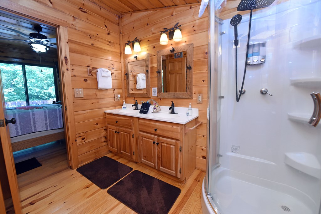 789 Old Mill Pond Road Mineral Bluff, GA 30559 - Photo 56 of 59 a bathroom with a sink a vanity and a mirror