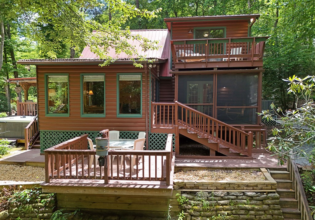 789 Old Mill Pond Road Mineral Bluff, GA 30559 - Photo 7 of 59 a view of a house with a deck