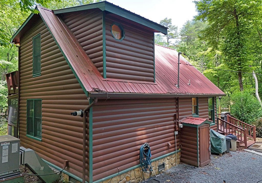 789 Old Mill Pond Road Mineral Bluff, GA 30559 - Photo 10 of 59 a front view of a house with a balcony