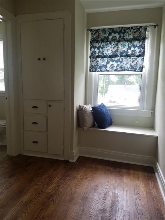 879 Mayfield Road Sharpsville, PA 16150 - Photo 13 of 18 Second floor hallway featuring built in storage and bench seat for additional storage. Bedrooms and hallway has refinished hardwood flooring.