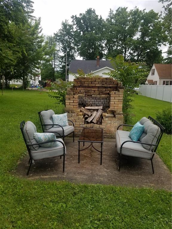 879 Mayfield Road Sharpsville, PA 16150 - Photo 17 of 18 Backyard fireplace and sitting area.