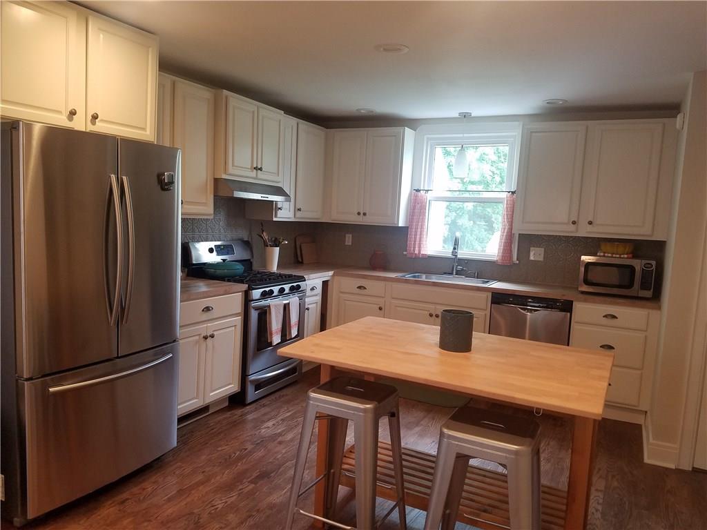 Kitchen all new cabinets, butcher block cabinets, stainless steal appliances, recessed lightening, and refinished hardwood flooring. 