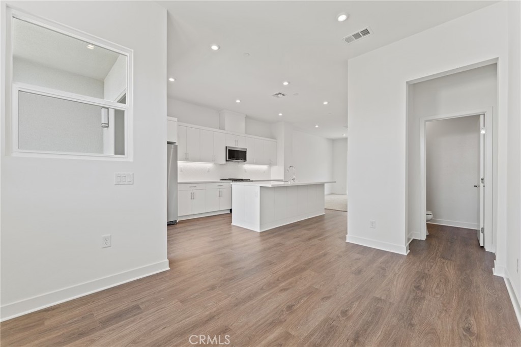 1822 West Bushell Street Anaheim, CA 92805 - Photo 16 of 34 a view of kitchen with wooden floor