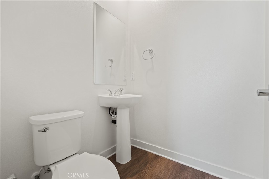 1822 West Bushell Street Anaheim, CA 92805 - Photo 17 of 34 a bathroom with a sink toilet and a mirror
