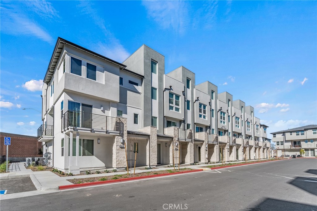 1822 West Bushell Street Anaheim, CA 92805 - Photo 2 of 34 a city street lined with buildings and a street view