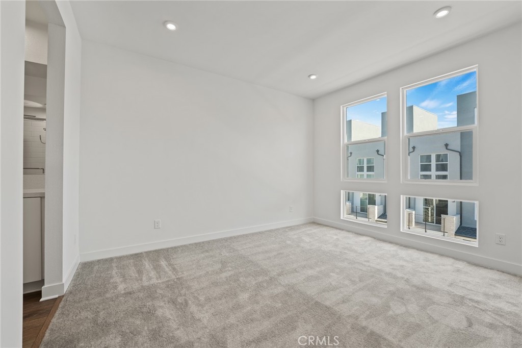 1822 West Bushell Street Anaheim, CA 92805 - Photo 22 of 34 a view of an empty room with a window