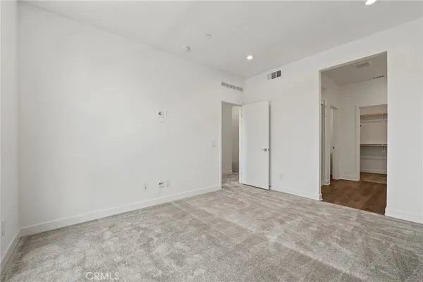 an empty room with closet area