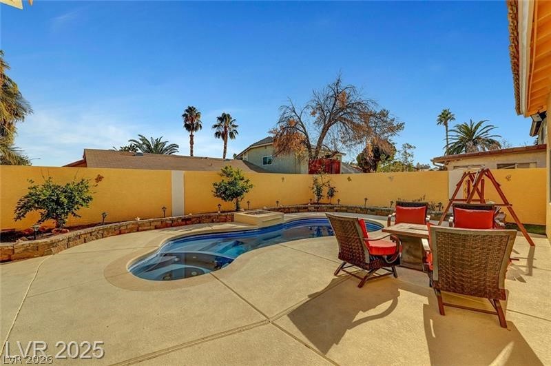 2410 Doherty Way Henderson, NV 89014 - Photo 51 of 63 View of swimming pool with a fenced backyard and a patio