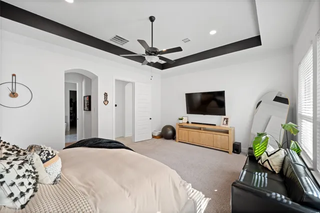 a very nice looking room with a couch and a mirror