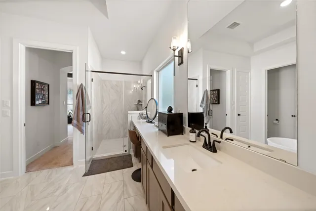 a bedroom with two beds and a table