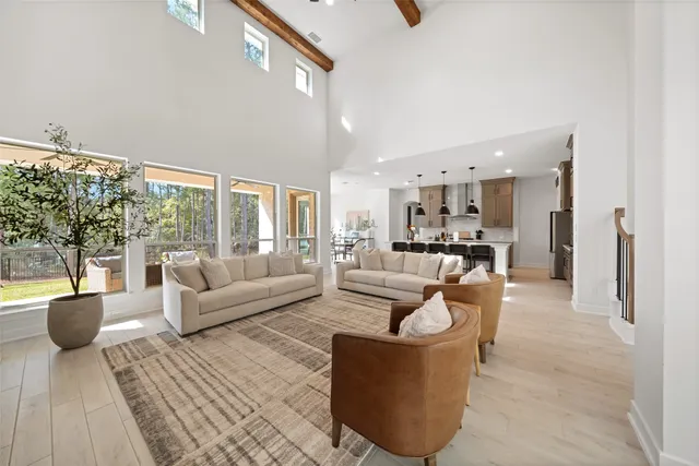 a bedroom with furniture and a flat screen tv
